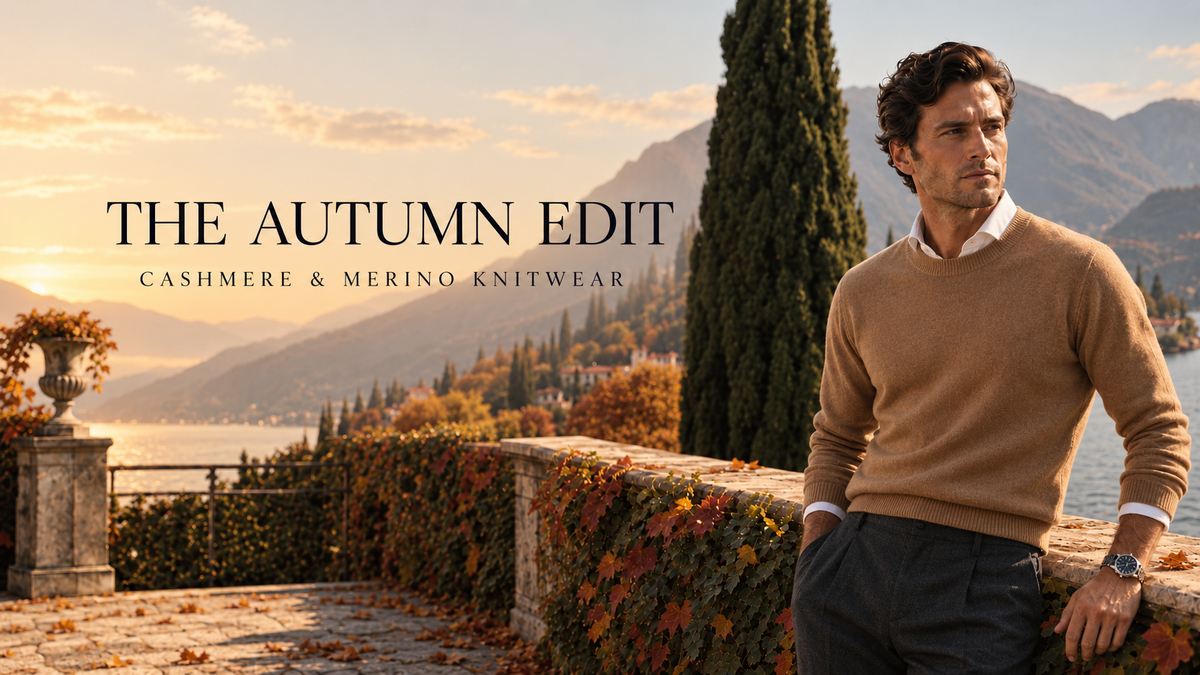 Man in a camel cashmere sweater on a lake terrace in autumn