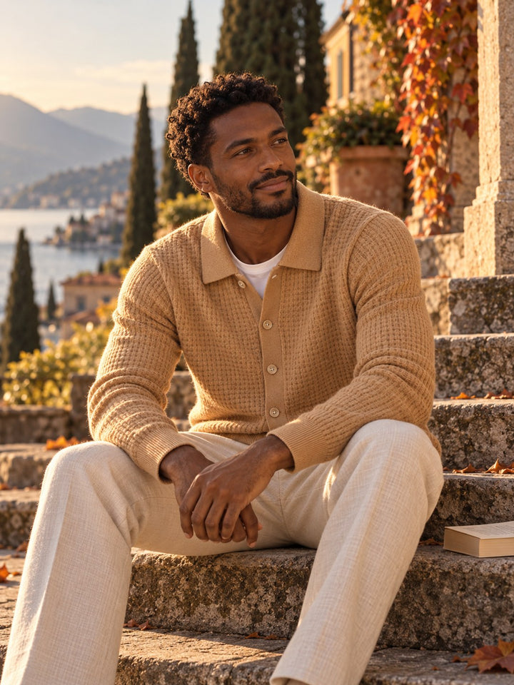 Man in a caramel textured cashmere cardigan on stone steps